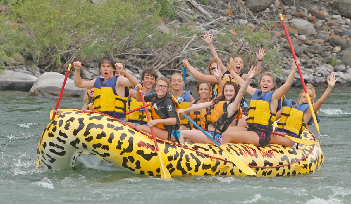 The Boiling River before the 2022 flood, with people swimming and soaking.